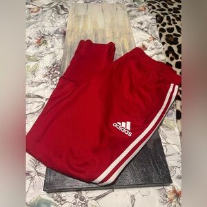 Red adidas track pants